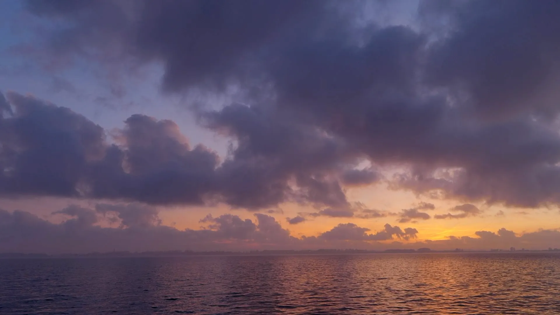 The sun sets over the IJsselmeer near Enkhuizen.